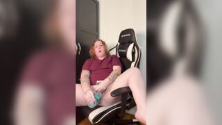 Amateur redhead masturbates in husbands gaming chair while he's at work