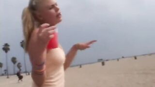 Petite teen masturbating on the beach