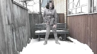 Mature milf with hairy pussy pissing on the snow in the courtyard of an abandoned house.